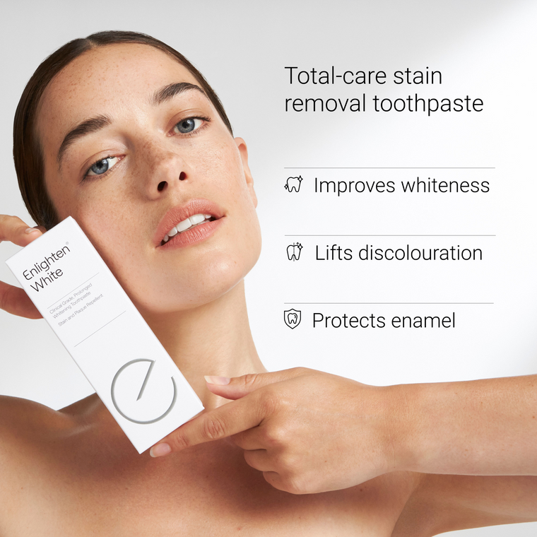  Woman holding Enlighten White highlighting stain removal benefits